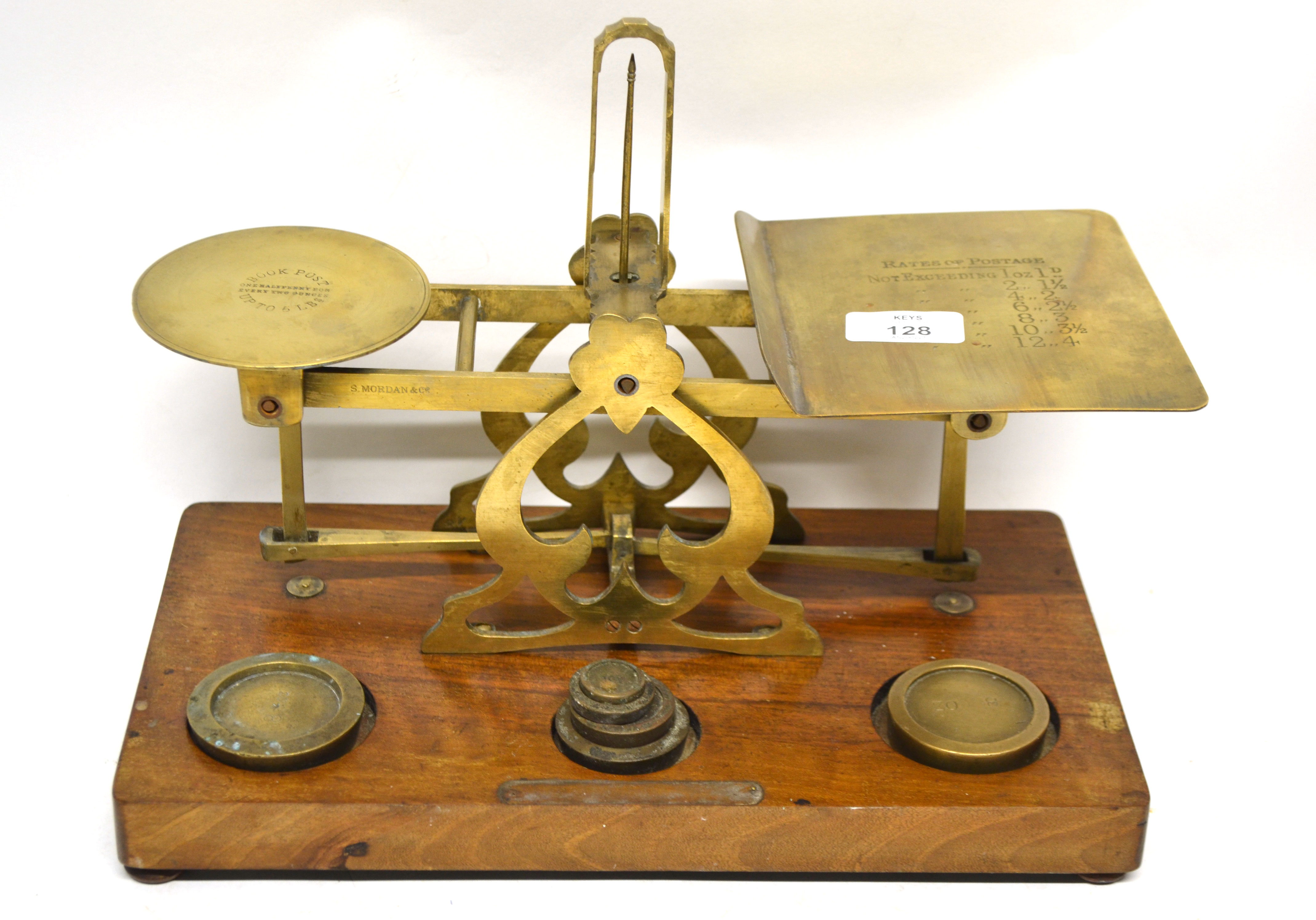 Set of postal scales with weights, on wooden mount, 33cm long