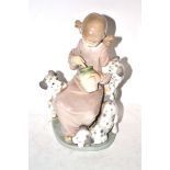 Lladro figure of a young girl with three puppies