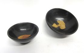 Two Chinese pottery bowls decorated in Song dynasty style with a black glaze, largest 10cm diam
