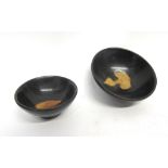 Two Chinese pottery bowls decorated in Song dynasty style with a black glaze, largest 10cm diam