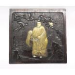 Chinese wooden panel with a relief design including a Chinese figure with face and feet picked out