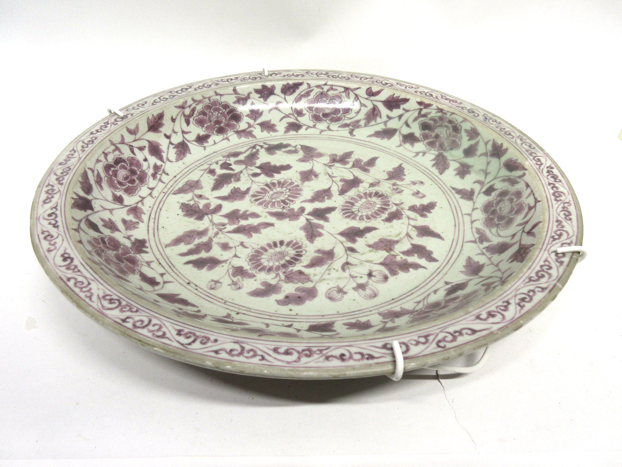 Large oriental porcelain charger decorated in copper red with a Ming style floral design, 40cm diam - Image 2 of 2