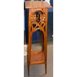 Pair of Art Nouveau style mahogany plant or bust stands, having square tops, foliate pierced and