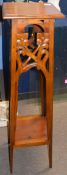 Pair of Art Nouveau style mahogany plant or bust stands, having square tops, foliate pierced and
