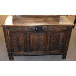 Oak coffer with three panel front and plain interior on stile feet 109cm wide