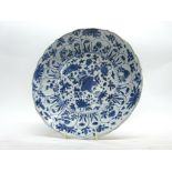 Chinese porcelain plate with a flowering design of plants in Kangxi style, with Kangxi motif to