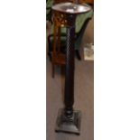 19th century dark mahogany torchere with circular top to a wrythen turned column and sloped square
