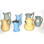 Group of 19th century relief moulded jugs including one with various European warriors, published by