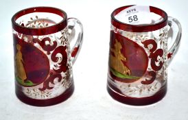 Two small glass tankards decorated in gilt with a young girl feeding birds, the other with a similar