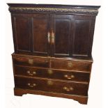 Early 18th century oak cabinet with chest base, having two inlaid double panelled doors beneath a