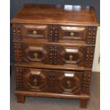 Jacobean style oak cabinet having plain lifting top above a moulded fronted dummy drawer, two double