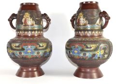 Pair of Oriental vases with cloisonne type decoration with elephant head handles, 33cm high (2)