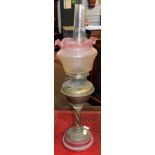 Late Victorian pink ceramic based/brass oil lamp with barley twist column, plain font and
