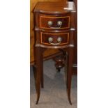 Miniature mahogany bow fronted chest of two drawers raised on four paw curved square legs, width