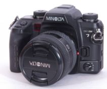 Minolta Dynax 7 camera with AF Zoom 24-205mm lens.