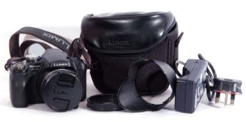 Lumix DMC-FZ18 camera with accessories.