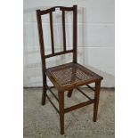 EARLY 20TH CENTURY CANE SEATED BEDROOM CHAIR WITH STRUNG DECORATION APPROX WIDTH 34CM