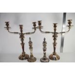 PAIR OF PLATED CANDELARBRA AND TWO FURTHER PLATED CANDLESTICKS