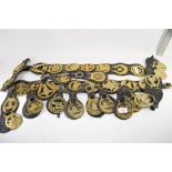 QTY OF HORSE BRASSES ON LEATHER STRAPS