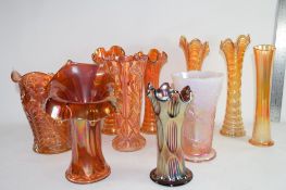 GROUP OF CARNIVAL GLASS VASES OF VARIOUS DESIGNS