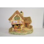 RESIN MODEL OF A HOUSE AND WISHING WELL