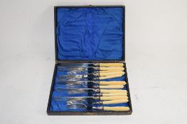 BOX OF PLATED FISH KNIVES AND FORKS
