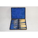 BOX OF PLATED FISH KNIVES AND FORKS