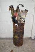 METAL STICK STAND WITH PAINTED FLORAL DECORATION CONTAINING AN ASSORTMENT OF VARIOUS PARASOLS,