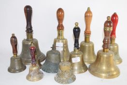 QUANTITY OF BRASS BELLS, MAINLY WITH WOODEN HANDLES