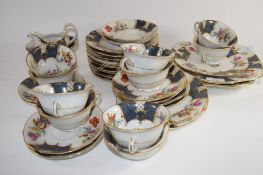 PART TEA SET WITH A FLORAL DESIGN COMPRISING TEN CUPS, SAUCERS, SIDE PLATES ETC