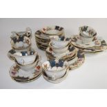 PART TEA SET WITH A FLORAL DESIGN COMPRISING TEN CUPS, SAUCERS, SIDE PLATES ETC