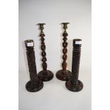 PAIR OF WOODEN BARLEY TWIST CANDELABRA AND TWO FURTHER CANDLE HOLDERS