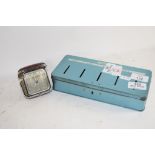 METAL MONEY BOX AND A TRAVELLING ALARM CLOCK