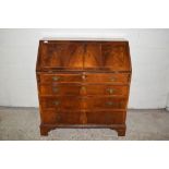 VENEERED FALL FRONT BUREAU WITH FITTED INTERIOR WITH FOUR LONG DRAWERS RAISED OVER BRACKET FEET,