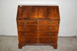 VENEERED FALL FRONT BUREAU WITH FITTED INTERIOR WITH FOUR LONG DRAWERS RAISED OVER BRACKET FEET,
