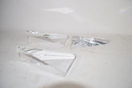 BOX CONTAINING THREE GLASS TRIANGULAR SCULPTURES