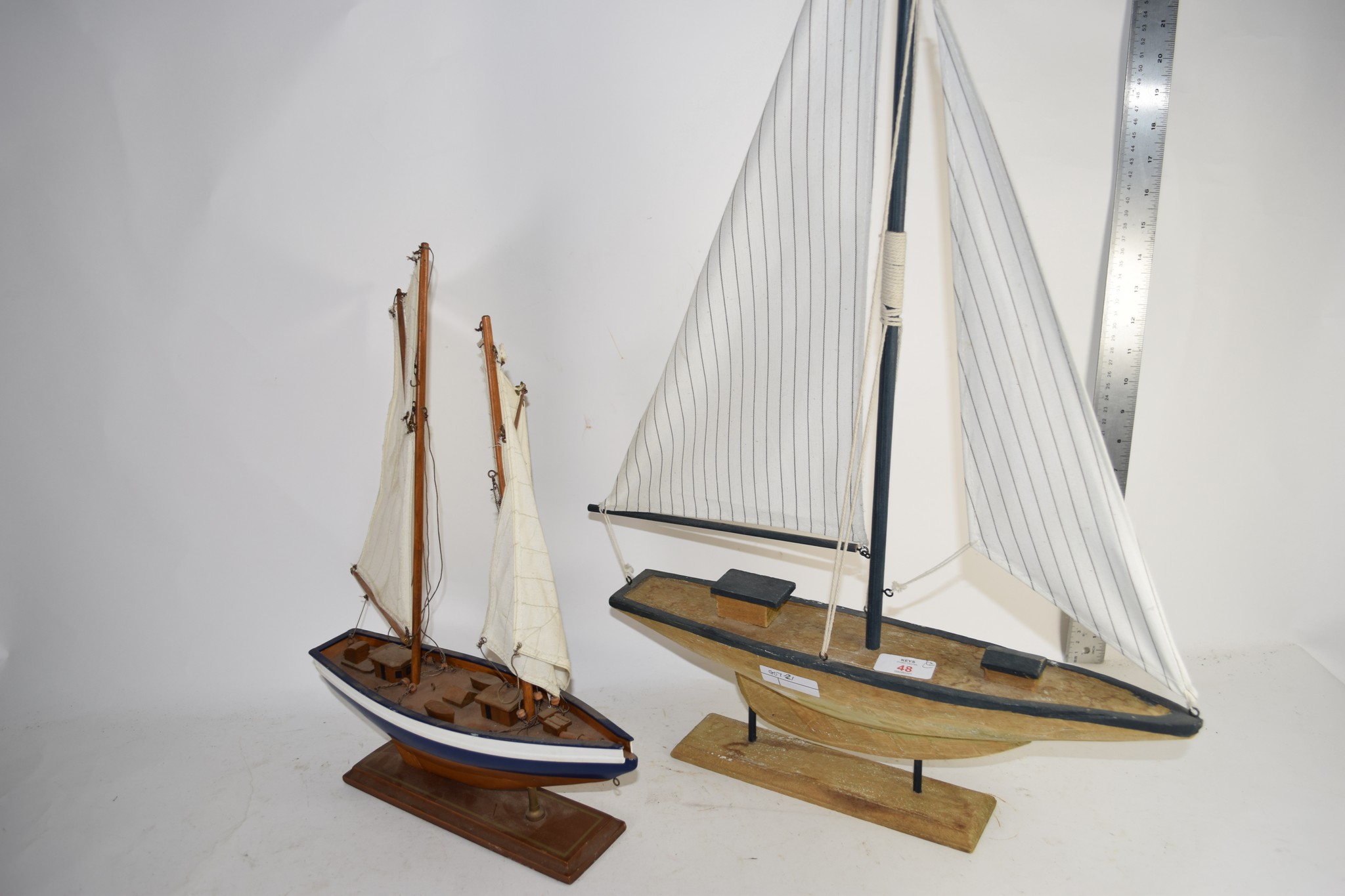 TWO SMALL MODELS OF A POND YACHTS ON WOODEN BASES