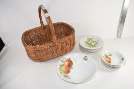 WICKERWORK BASKET CONTAINING SMALL GROUP OF CHINA DECORATED WITH FRUIT