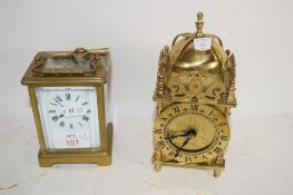 TWO CLOCKS, CARRIAGE CLOCK AND A FURTHER SKELETON LANTERN CLOCK