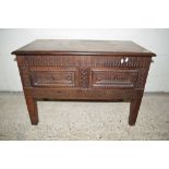 HEAVILY CARVED STORAGE CHEST WITH GEOMETRIC DECORATION TO THE LID, LENGTH APPROX 92CM, CONTAINING