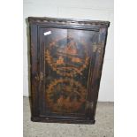 SMALL PAINTED WOOD CORNER WALL CABINET WITH DECORATIVE ILLUSTRATIONS OF MAN ON HORSEBACK ETC,