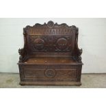 HEAVILY CARVED OAK SETTLE WITH STORAGE BOX, WIDTH APPROX 117CM