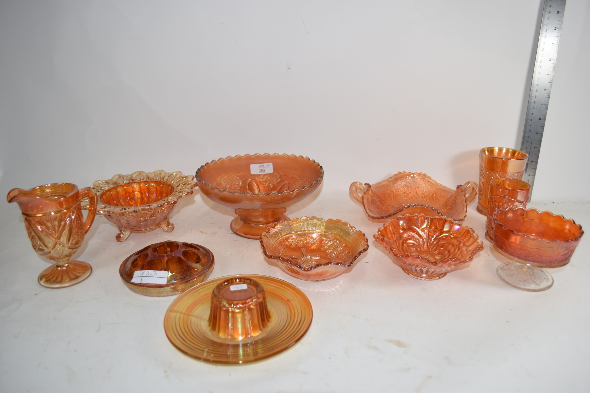 CARNIVAL GLASS WARES INCLUDING SMALL BOWL IN THE WILD ROSE PATTERN, SMALL VASE IN THE LATTICE AND