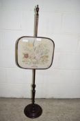 MAHOGANY FIRE POLE INSET WITH EMBROIDERED FLORAL DECORATION, HEIGHT APPROX 116CM