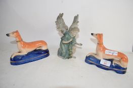 TWO STAFFORDSHIRE PEN HOLDERS MODELLED AS GREYHOUNDS ON BLUE BASES, PLUS A FURTHER CERAMIC FIGURE