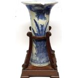 Oriental vase of tapered shape and flared neck, decorated in underglaze blue with a river scene