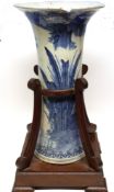 Oriental vase of tapered shape and flared neck, decorated in underglaze blue with a river scene