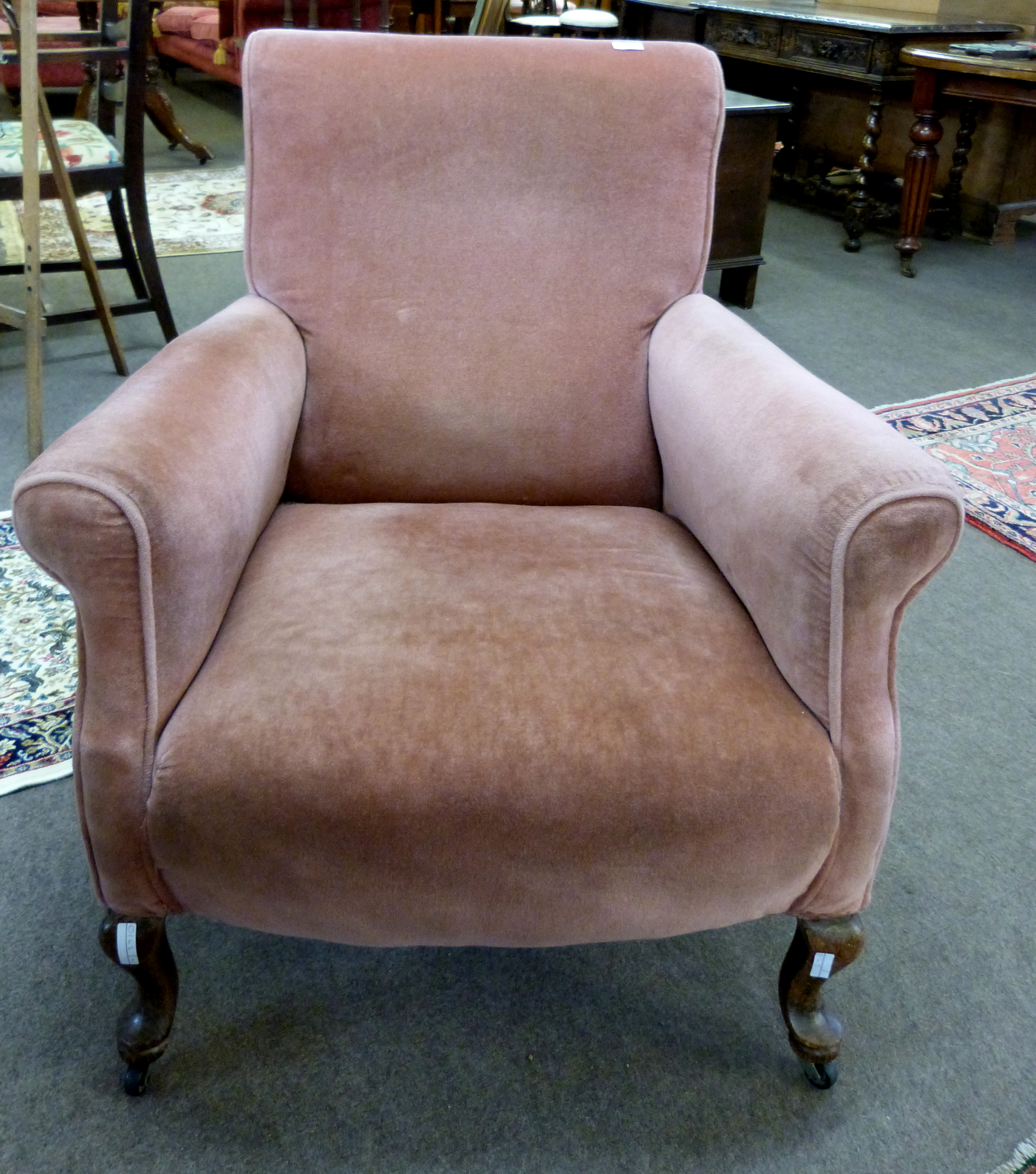 Early 20th century stained oak and pink Dralon upholstered armchair with front cabriole legs and