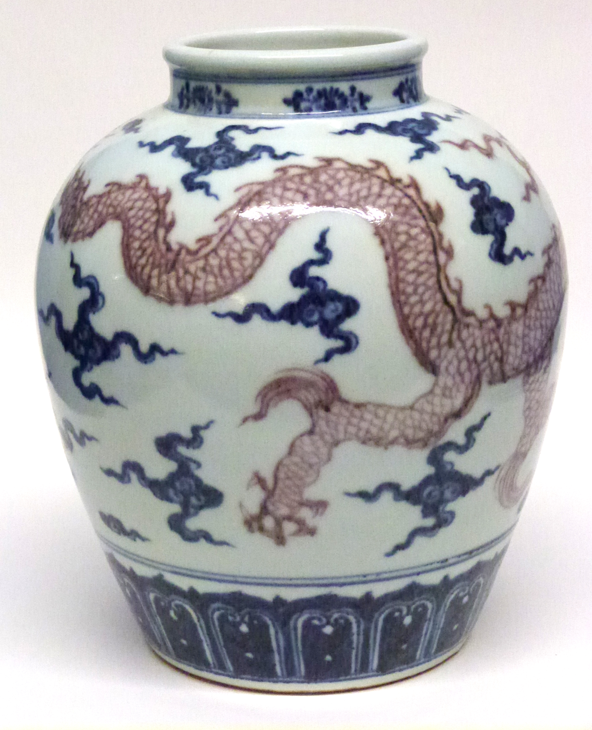 Chinese porcelain globular vase decorated in Ming style, with a Chinese dragon in iron red chasing