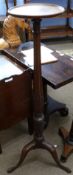 Early 20th century mahogany torchere with plain circular top, bulbous carved panelled column with